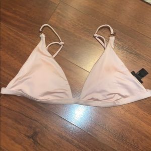 Light pink shiney material(appears velvet)